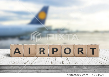 Airport word sign on a wooden surface with a plane Airport word sign on a wooden surface with a plane 47545219