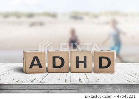 ADHD sign on a wooden table with kids ADHD sign on a wooden table with kids 47545221