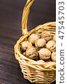 Walnuts in a basket 47545703