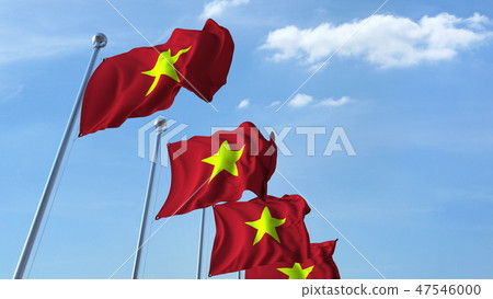 Row of waving flags of Vietnam agaist blue sky, 3D rendering Row of waving flags of Vietnam agaist blue sky, 3D rendering 47546000