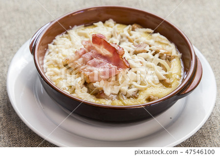 banosh with cheese and bacon in a clay bowl banosh with cheese and bacon in a clay bowl 47546100