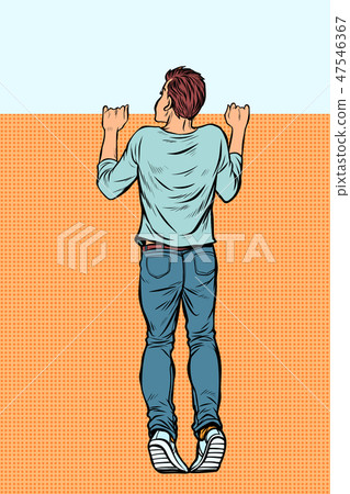 young man looks over the fence 47546367