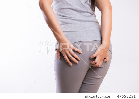 Woman suffering from hemorrhoids  47552251