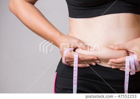 Fat woman hand holding excessive belly fat Fat woman hand holding excessive belly fat 47552253
