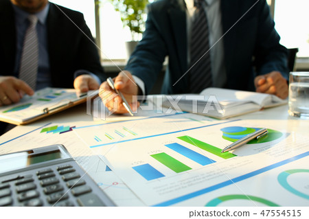 Silver calculator and financial statistics on clipboard Silver calculator and financial statistics on clipboard 47554515