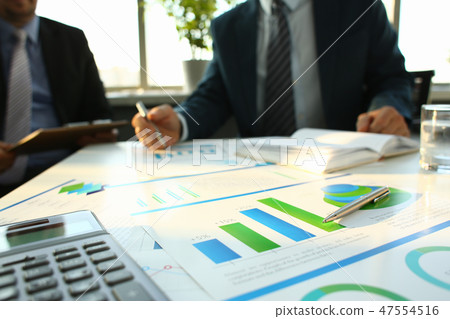 Silver calculator and financial statistics on clipboard 47554516