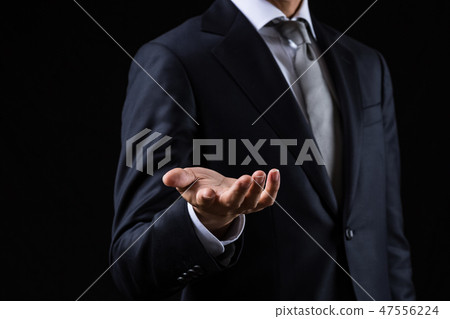 A businessman to reach out A businessman to reach out 47556224
