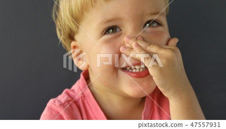 Cute Little Boy Point at His Nose 47557931