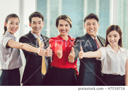 Businesspeople showing thumb up sign 47559716
