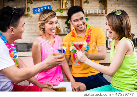 Group of friends enjoying cocktail Group of friends enjoying cocktail 47559777