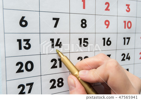 Hand marker indicates the date on the wall Hand marker indicates the date on the wall 47565941