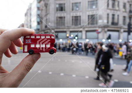 man with a londoner red double-decker bus man with a londoner red double-decker bus 47566921