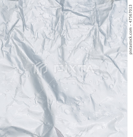 Crumpled wet plastic texture background 47567013