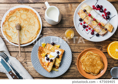 Different types of pancakes with berries pancake,  47569405