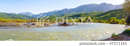 Panorama of a mountain valley with a river 47571165