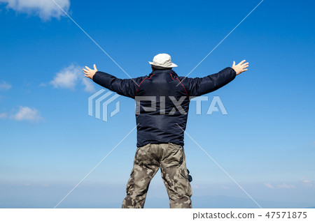 Joyful man and sky Joyful man and sky 47571875