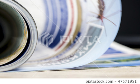 Flipping through a magazine Flipping through a magazine 47571951