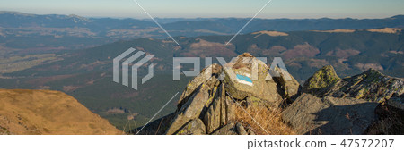 Panoramic view of idyllic mountain scenery in sunny day 47572207