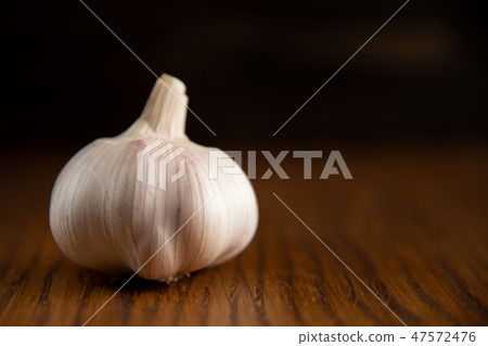 Garlic bulb on the wooden vintage background 47572476