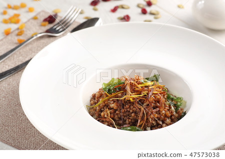 Buckwheat porridge buckwheat porridge in a white plate. Russian traditional food 47573038