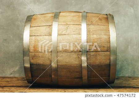 Wooden barrel and worn old table of wood. 47574172