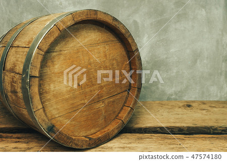 Wooden barrel and worn old table of wood. Wooden barrel and worn old table of wood. 47574180