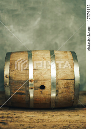 Wooden barrel and worn old table of wood. Wooden barrel and worn old table of wood. 47574181