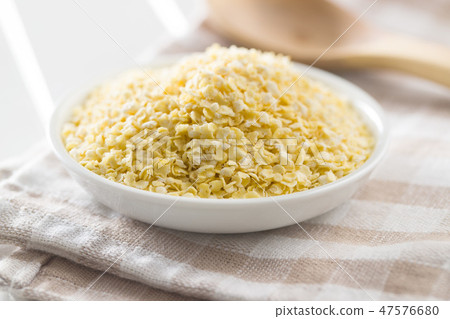 Healthy millet flakes. 47576680