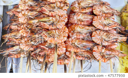 Grilled shrimp skewers on a street food stal. Grilled shrimp skewers on a street food stal. 47577930