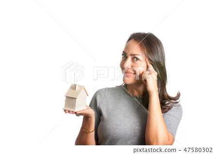 Woman dreaming with a new house isolated 47580302