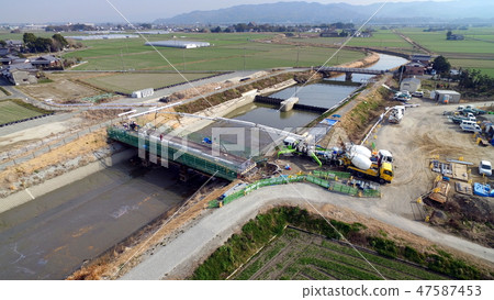 Rebuilding of bridges by river expansion measures against flood damage, appearance of concrete drilling work between rebar bars, 47587453