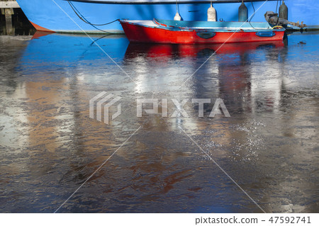 Boat in frozen water Boat in frozen water 47592741