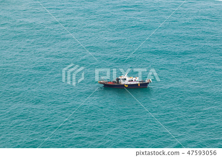 Small fishing motorboat boat goes slowly Small fishing motorboat boat goes slowly 47593056