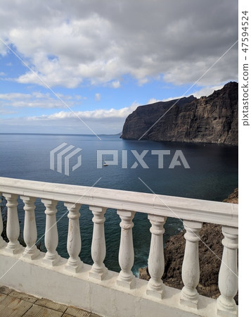Los Gigantes cliffs behind the fence in Tenerife Los Gigantes cliffs behind the fence in Tenerife 47594524