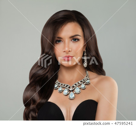 Luxurious woman with makeup, long curly hair Luxurious woman with makeup, long curly hair 47595241