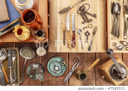 An overhead photo of many vintage objects, flea market stuff on a wooden background 47595551