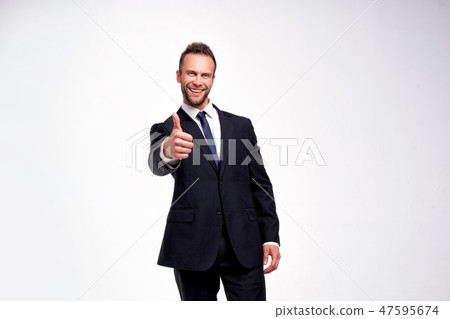 businessman showing thumbs up gesture businessman showing thumbs up gesture 47595674