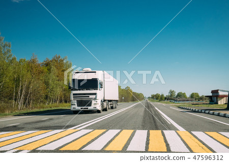 Truck On Country Road. Tractor Unit, Prime Mover, Traction Unit In Motion On Countryside Road In 47596312