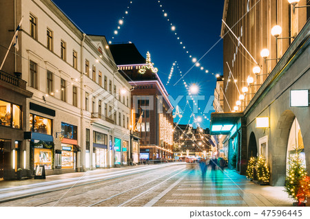 Helsinki, Finland. Night View Of Aleksanterinkatu Street With Railroad In Kluuvi District In Evening Helsinki, Finland. Night View Of Aleksanterinkatu Street With Railroad In Kluuvi District In Evening 47596445