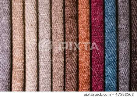 Colorful and bright fabric samples of furniture and clothing upholstery. Close-up of a palette of 47598568
