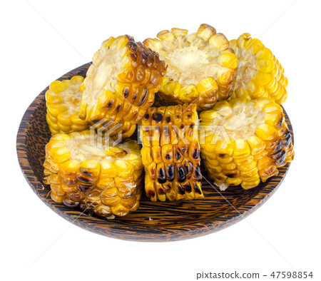 Slices of grilled corn on wooden plate Slices of grilled corn on wooden plate 47598854