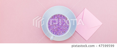 Cup of beautiful lilac flowers infused water Cup of beautiful lilac flowers infused water 47599599