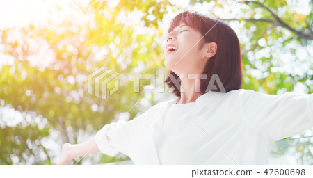 young woman feel carefree 47600698