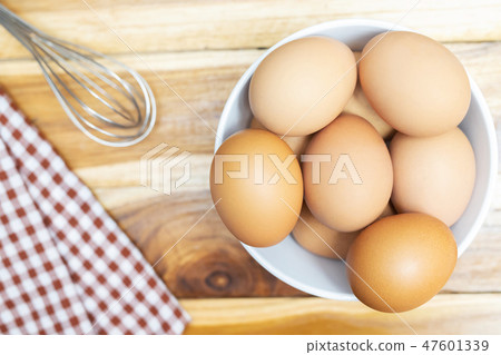 raw chicken eggs in egg box on the table wooden. 47601339