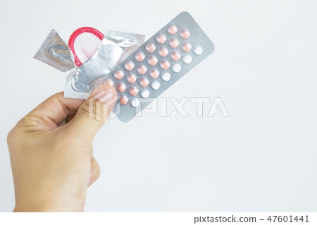 Contraceptive means: Woman hand holding  47601441
