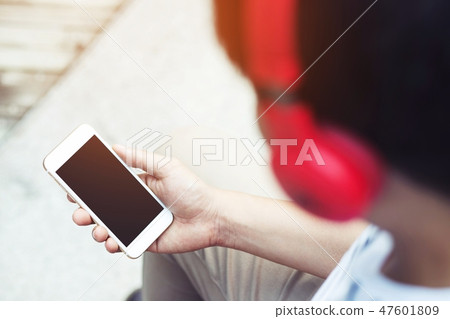young man holding hand smart phone young man holding hand smart phone 47601809