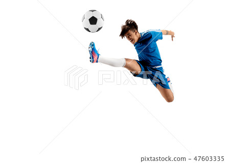 Young boy with soccer ball doing flying kick 47603335