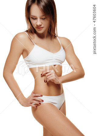 Perfect slim toned young body of the girl . Perfect slim toned young body of the girl . 47603604