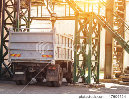 Plant for processing and storing grain, a truck is loaded with grain, works grain 47604514