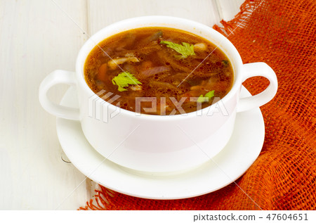 Soup with vegetables on white wooden surface Soup with vegetables on white wooden surface 47604651